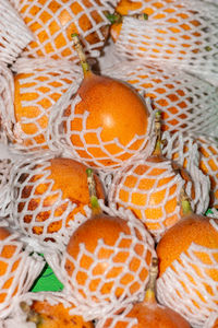 High angle view of orange fruits in basket