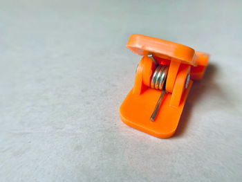 Close-up of orange on table against white background