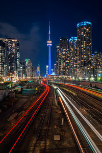 High angle view of light trails on road at night