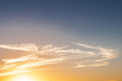Low angle view of cloudy sky at sunset