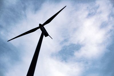 Low angle view of windmill against sky