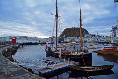 Boats moored at harbor