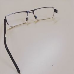 Close-up of eyeglasses on table against white background