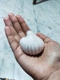 Close-up of hand holding ice cream