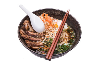 High angle view of food in bowl against white background