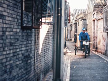 People sitting in alley