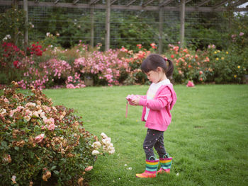 Full length of cute girl playing at park