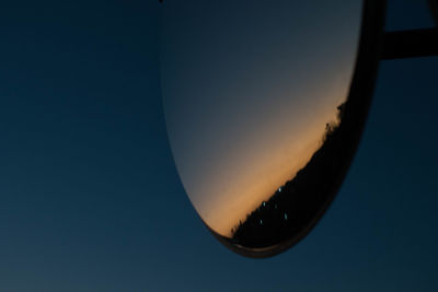 Low angle view of moon against sky during sunset
