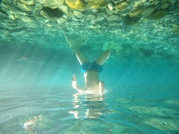 Woman swimming in sea