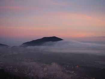 Aerial view of cityscape against sky during sunset