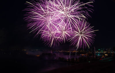 Firework display at night