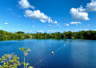 Scenic view of lake against blue sky