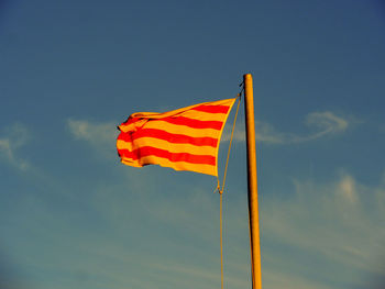 Low angle view of flag against sky