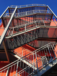 Low angle view of staircase in building against sky