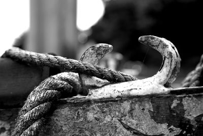 Close-up of rope tied on cleat at pier
