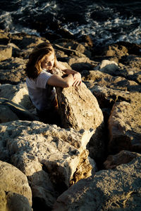 Full length of woman on rock