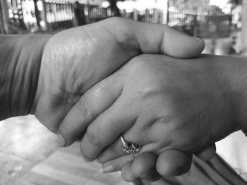 Midsection of man holding hands