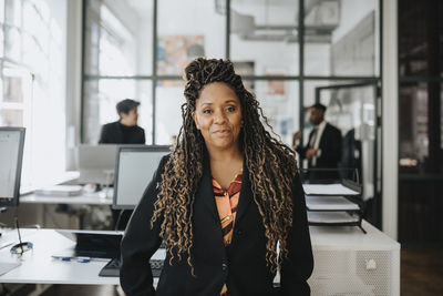 Portrait of mature businesswoman with dreadlocks at office