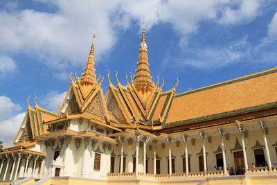 View of temple building against cloudy sky