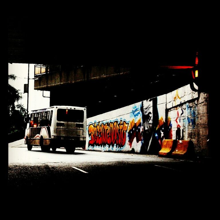 street, transportation, architecture, built structure, building exterior, transfer print, land vehicle, city, night, car, mode of transport, auto post production filter, multi colored, road, illuminated, graffiti, store, text, city life, incidental people