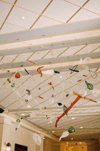 Low angle view of illuminated lights hanging from ceiling