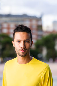 Portrait of young man standing outdoors