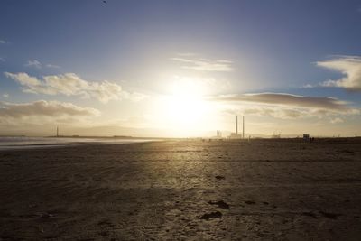 Scenic view of beach against sky during sunset