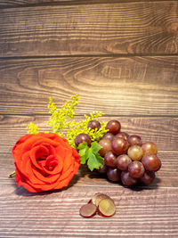 Red roses on table against white background