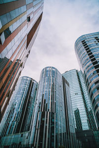 Low angle view of modern buildings against sky