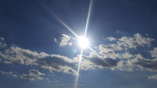 Sun shining through clouds
