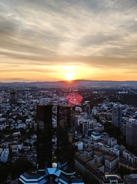 High angle view of city at sunset