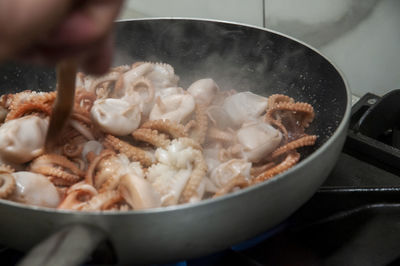 Cooking octopus in a pan close up