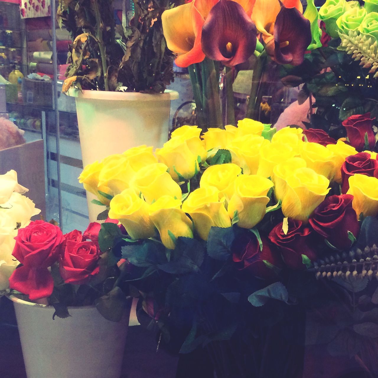 flower, indoors, vase, petal, freshness, fragility, flower head, rose - flower, bouquet, yellow, decoration, flower arrangement, home interior, plant, growth, close-up, beauty in nature, potted plant, table, tulip