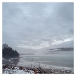 Scenic view of snowcapped landscape against sky