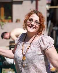 Portrait of smiling woman standing outdoors