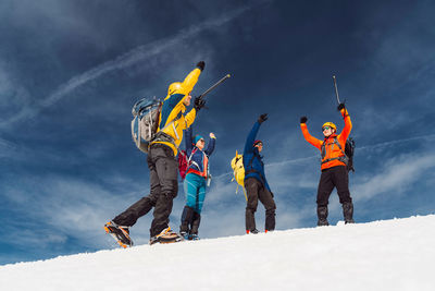 Low angle view of man skiing on snow