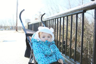 Portrait of baby girl on baby stroller