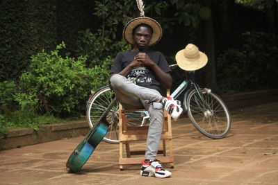 Serious man sitting on chair