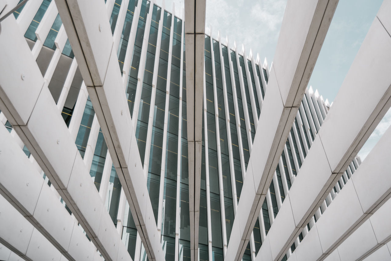 architecture, built structure, building exterior, building, glass - material, low angle view, no people, modern, day, window, city, reflection, pattern, outdoors, office, transparent, railing, nature, architectural feature, office building exterior, ceiling