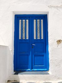 Closed blue door of building