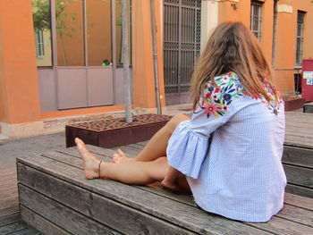 Woman sitting in traditional clothing