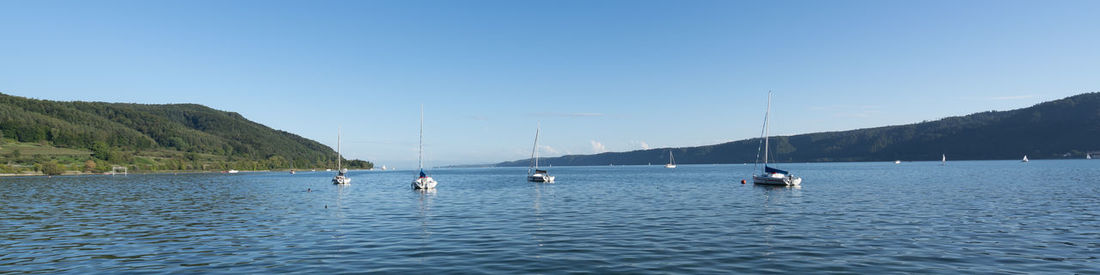 Scenic view of sea against clear blue sky