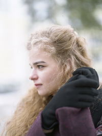 Portrait of young woman in snow