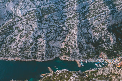 High angle view of rock formations in sea