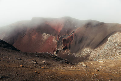 Scenic view of volcanic mountain against sky