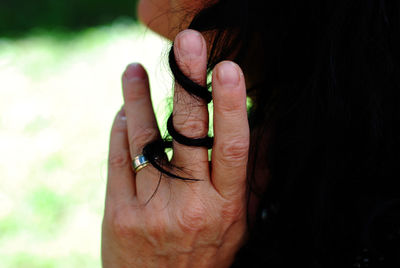 Midsection of woman wearing finger ring