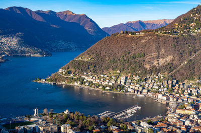 The city of como, the lake, the lakeside promenade, the buildings, photographed from above.