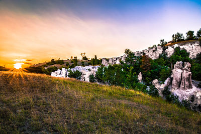 Scenic view of landscape against sky during sunset