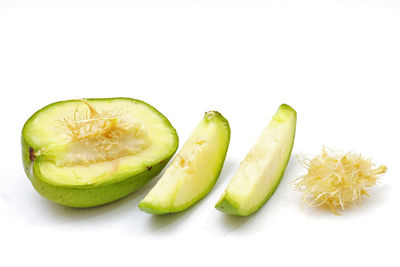 Close-up of bananas against white background