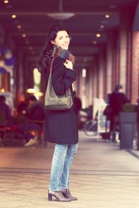 Full length of woman standing in park